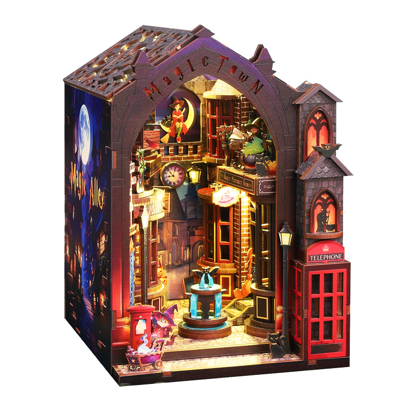 Assembled Magic Alley book nook with glowing shop windows, red telephone box and fountain